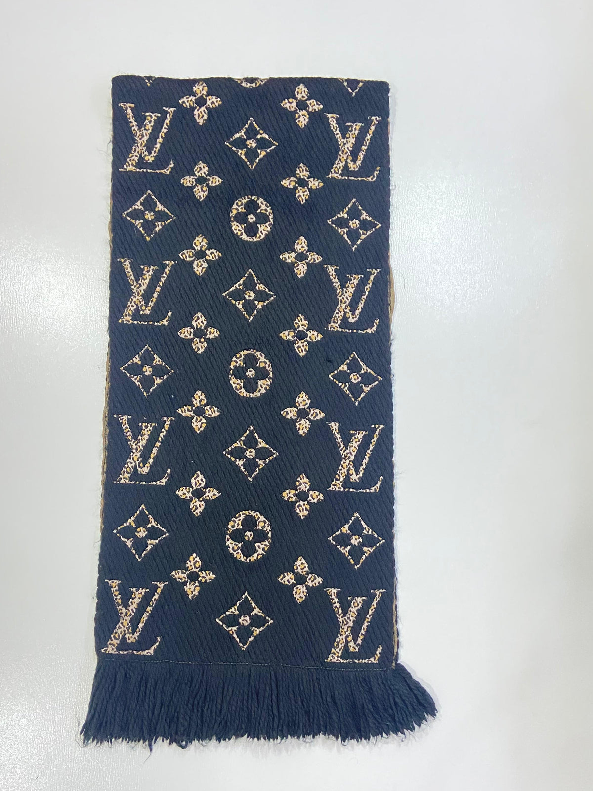 Louis Vuitton Giant Monogram Jungle Wool Silk Scarf M75884 in Black and Gold, laid flat