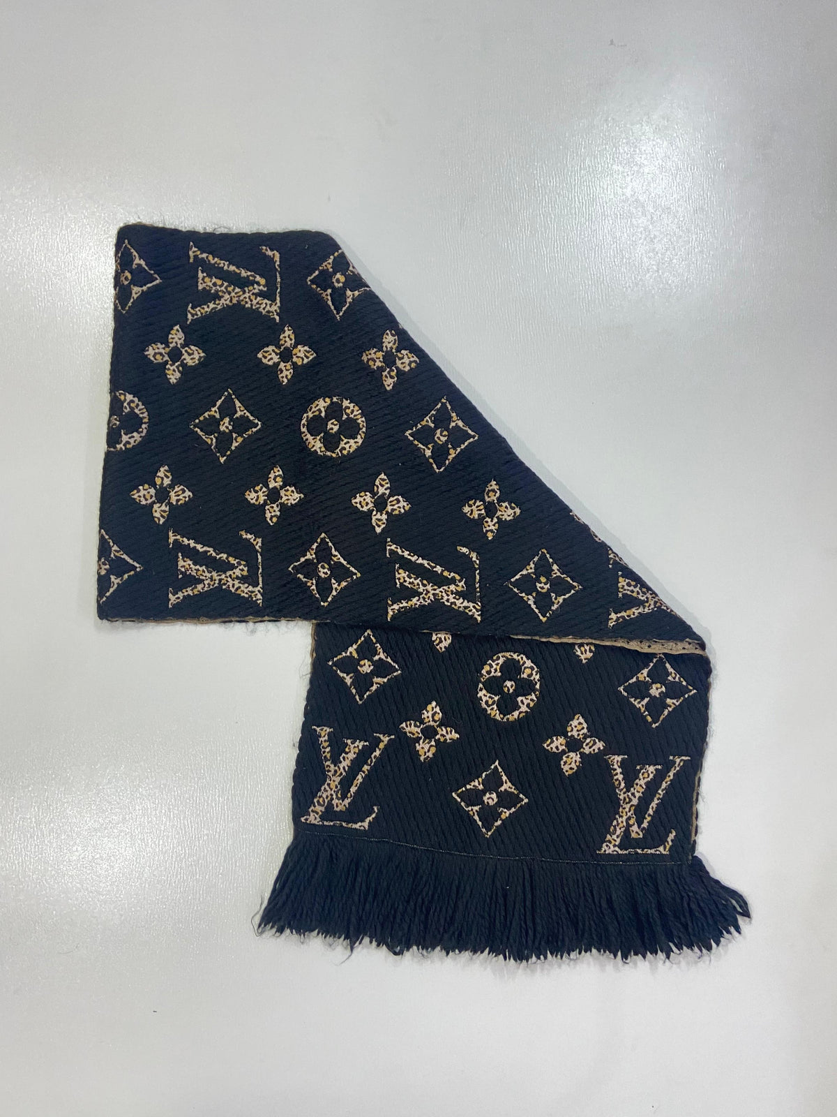 Reversible Louis Vuitton Echarpe Giant Monogram Jungle Scarf showing animal print monogram details