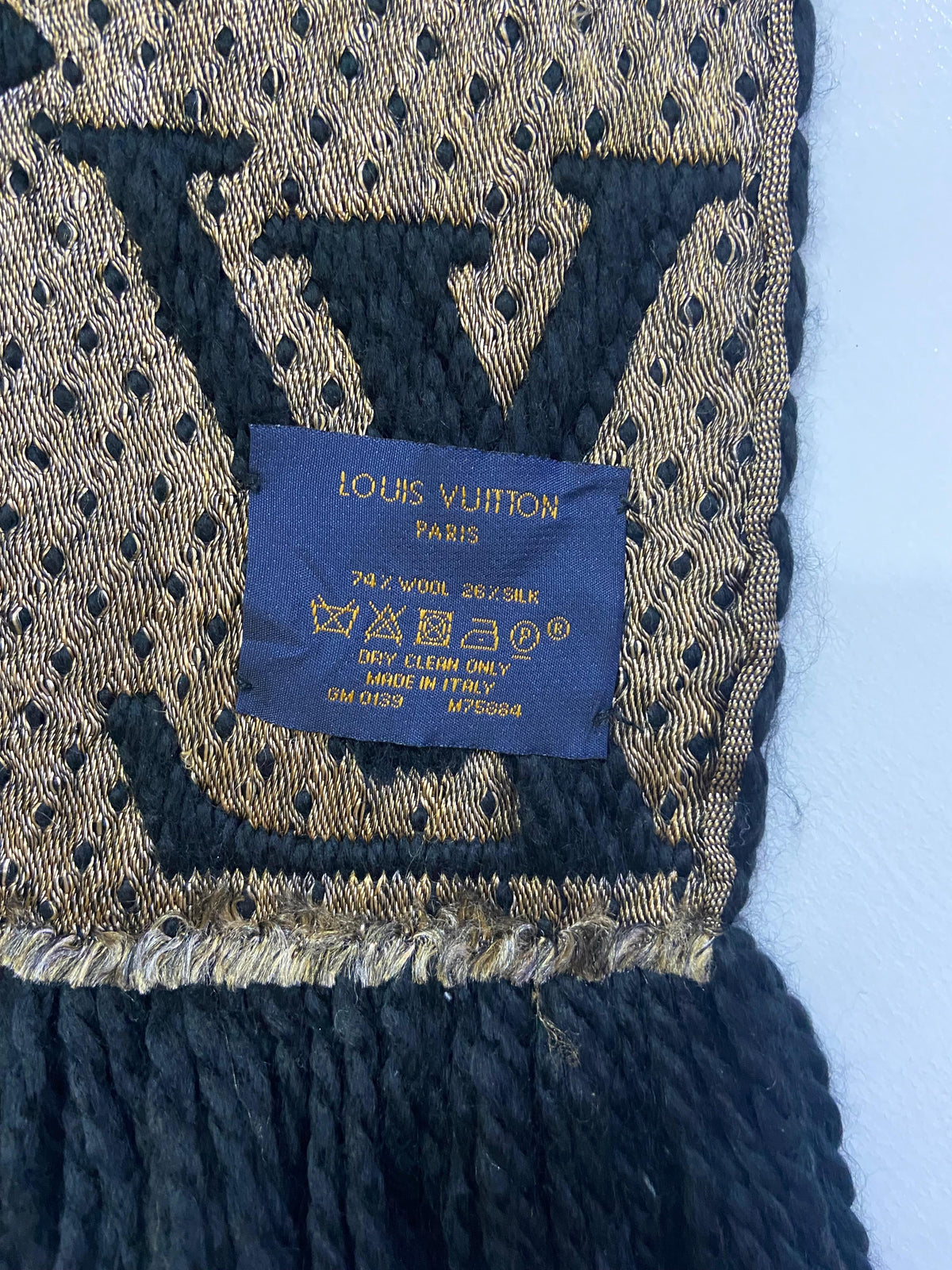 Louis Vuitton care label showing model M75884, date code GM0139, and 74% wool 26% silk fabric composition